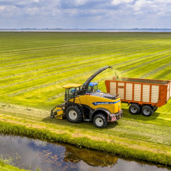 tractors-on-fresh-mowed-green-agricultural-grassland.jpg